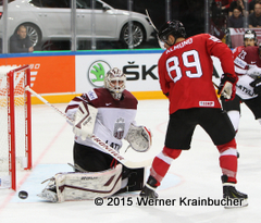 IIHF World Championship 2015  Preliminary Round SUI - LAT Edgars MASALSKIS (LAT); Cody ALMOND (SUI) ⒸWerner Krainbucher/Puckfans.at 