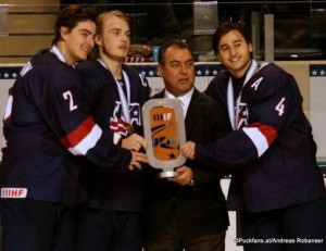 2016 IIHF U18 World Championship Bronze Medal Game USA - CAN Ralph Engelstad Arena, Grand Forks Luke Martin #2, Ryan Lindgren #18, Frank Gonzales IIHF, Chad Krys #4 ©Puckfans.at/Andreas Robanser